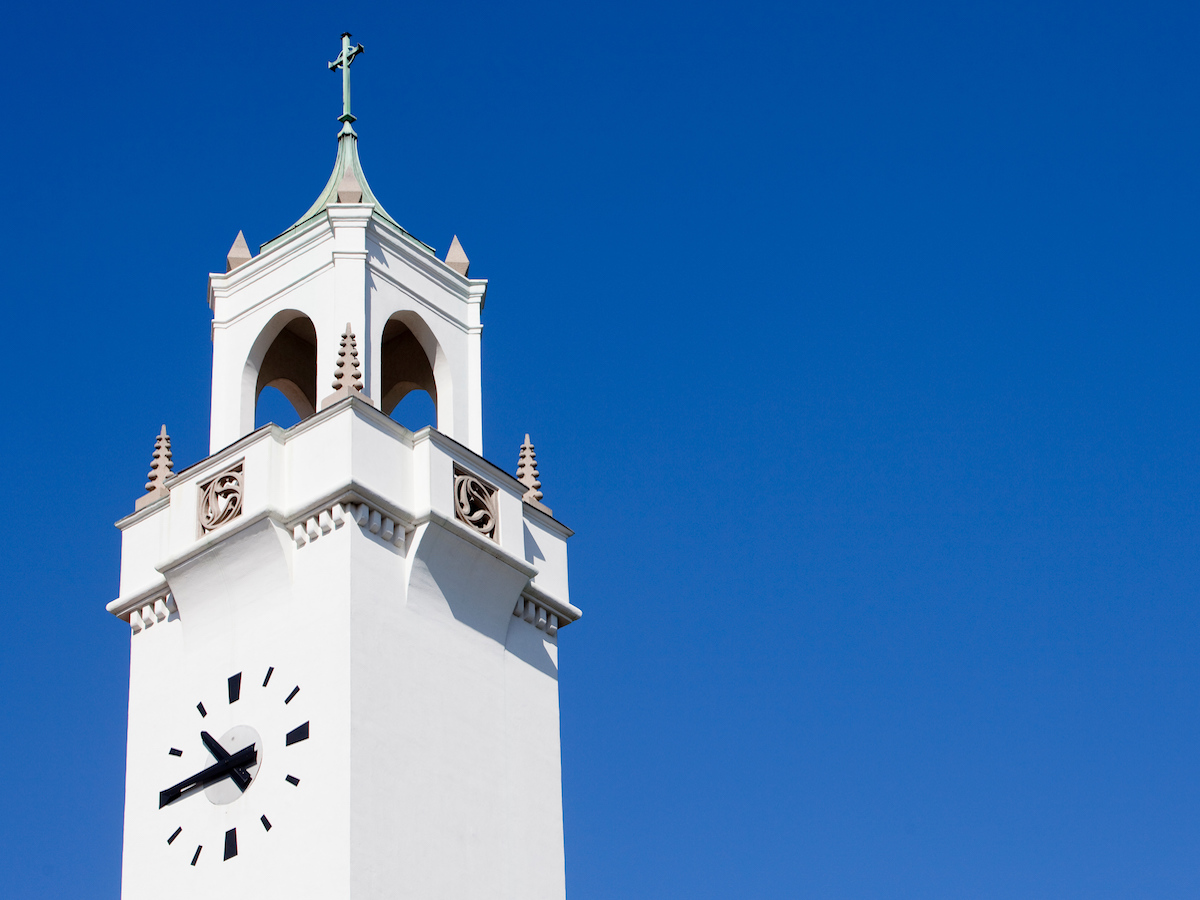 Sacred Heart Chapel Tower against blue sky